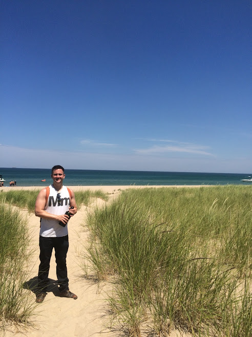 Mike hiking down the dune to Lake Michigan.