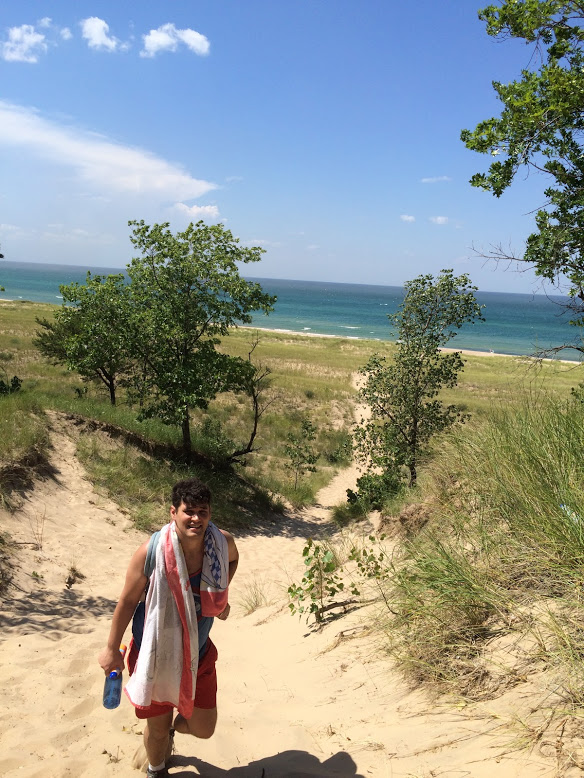 Michael hiking back up the steep dunes after a few hours swimming in that Great Lake.